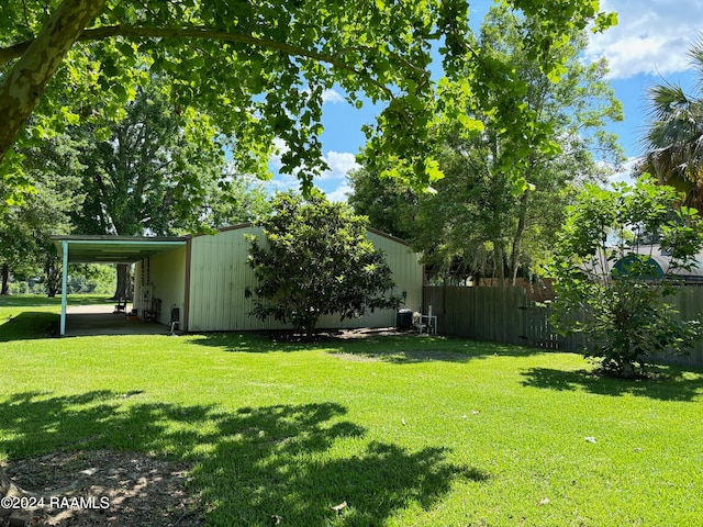 view of yard with a carport