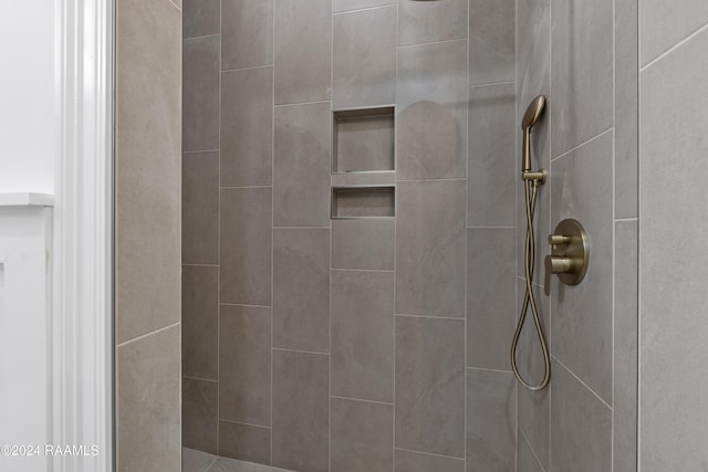 bathroom with tiled shower