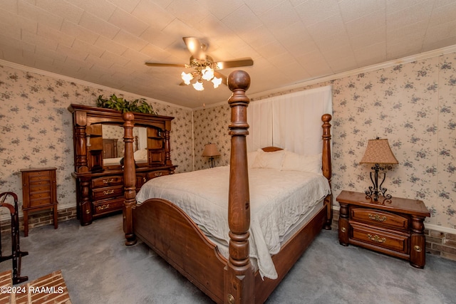 bedroom featuring ceiling fan, ornamental molding, and carpet floors