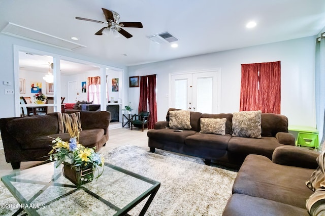 tiled living room featuring ceiling fan