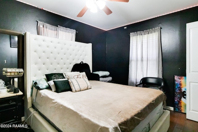 bedroom featuring ceiling fan and dark hardwood / wood-style floors