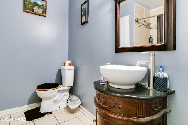 bathroom featuring tile floors, toilet, and vanity