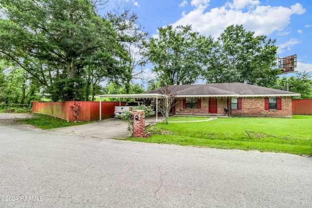 ranch-style house with a front yard