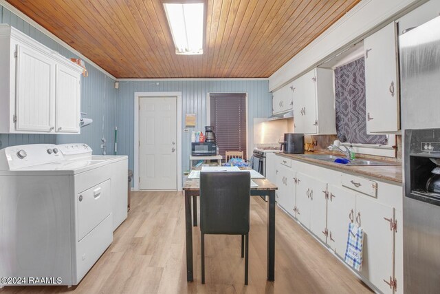 kitchen with separate washer and dryer, white cabinetry, wooden ceiling, and crown molding