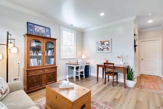 living room featuring crown molding, a barn door, and light wood-type flooring