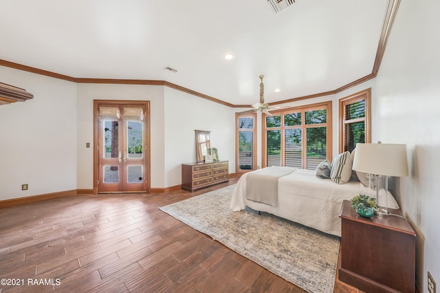 bedroom featuring ornamental molding and dark hardwood / wood-style flooring