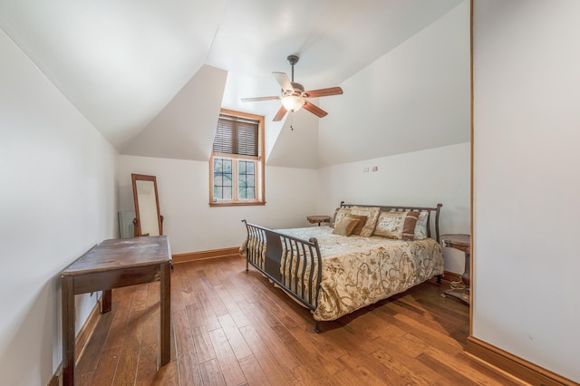 bedroom featuring dark wood-type flooring, ceiling fan, and lofted ceiling