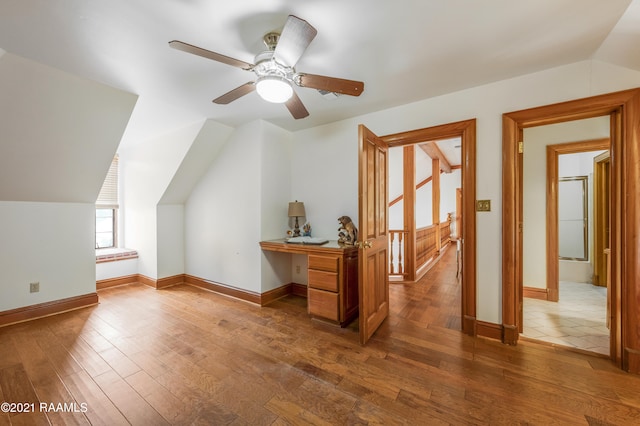 bonus room with ceiling fan, vaulted ceiling, and hardwood / wood-style flooring