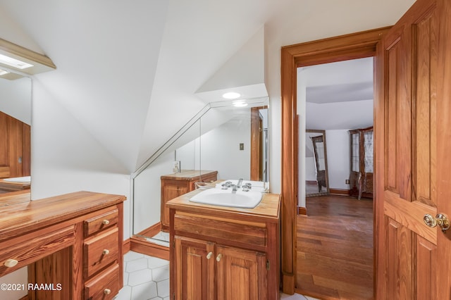 bathroom with hardwood / wood-style flooring and vanity