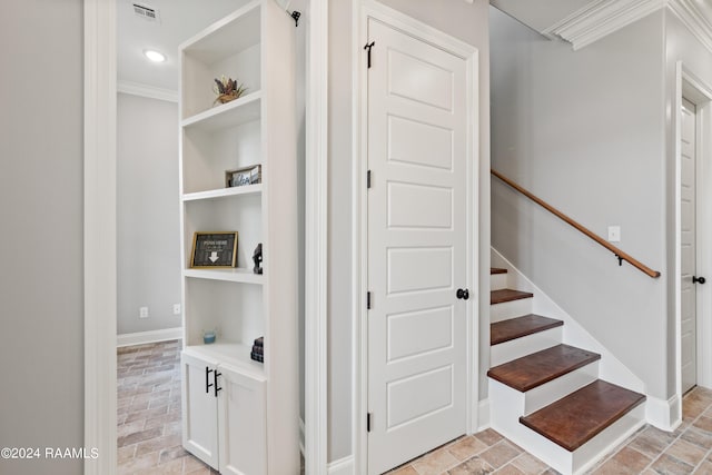 staircase with crown molding