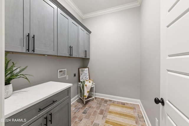 washroom with hookup for an electric dryer, cabinets, ornamental molding, and hookup for a washing machine