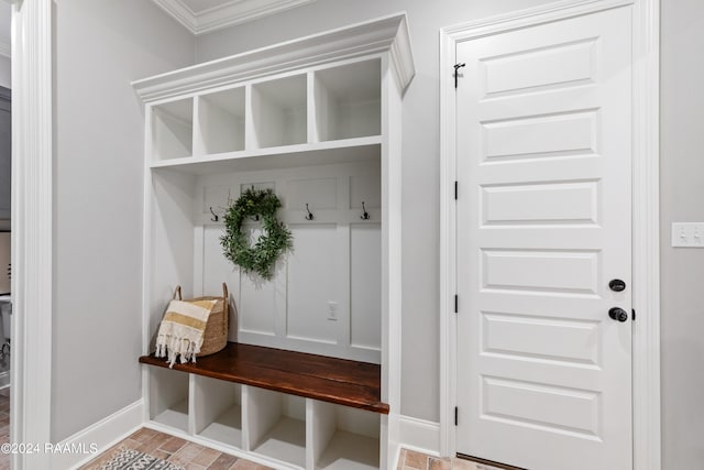 mudroom featuring ornamental molding