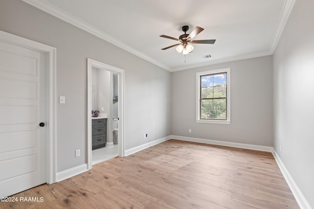 spare room with light hardwood / wood-style flooring, ceiling fan, and crown molding