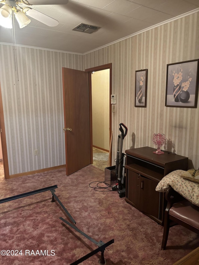 interior space featuring ceiling fan and ornamental molding