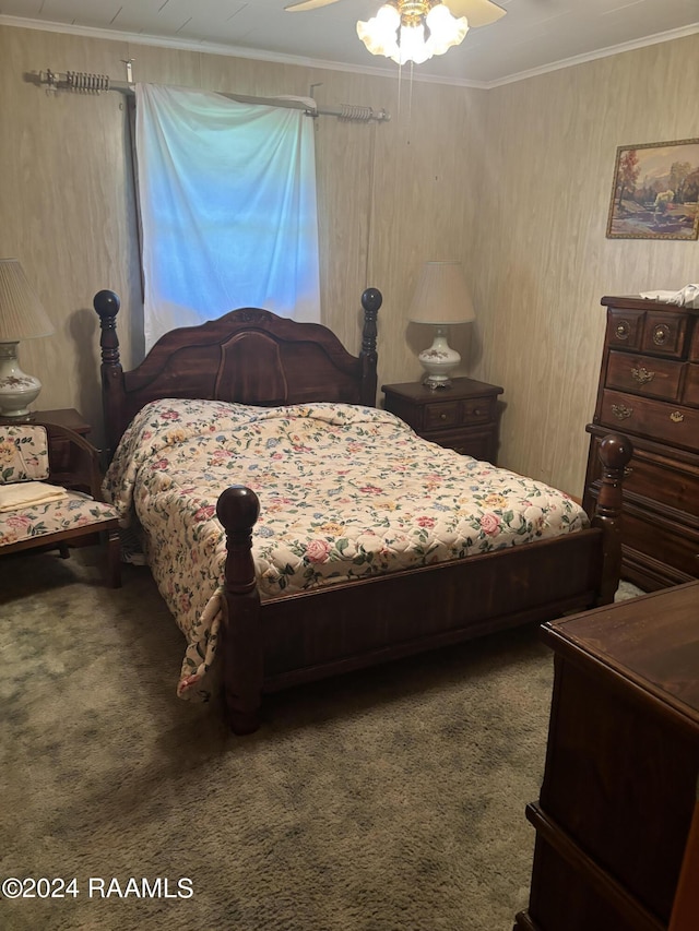 bedroom featuring ceiling fan, crown molding, and carpet