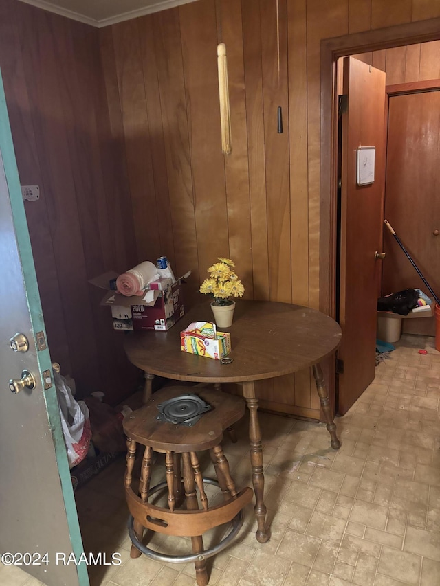 dining area with wood walls