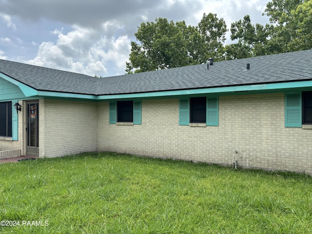 view of home's exterior featuring a yard