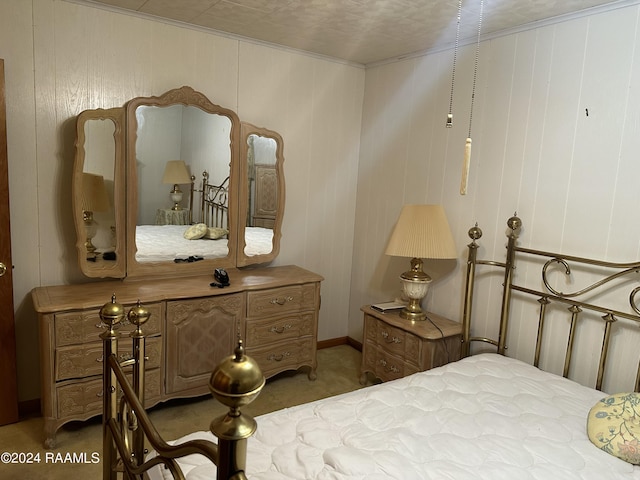 carpeted bedroom featuring crown molding