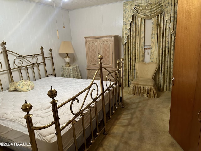 bedroom featuring dark colored carpet