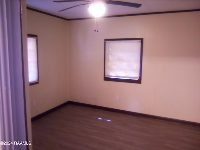 unfurnished room featuring dark hardwood / wood-style flooring and ceiling fan