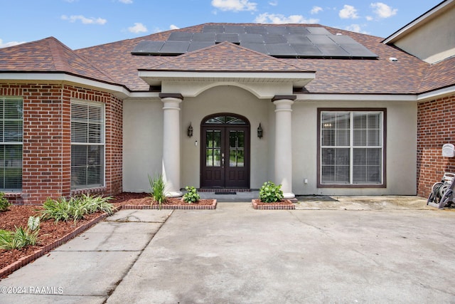 entrance to property with french doors and solar panels