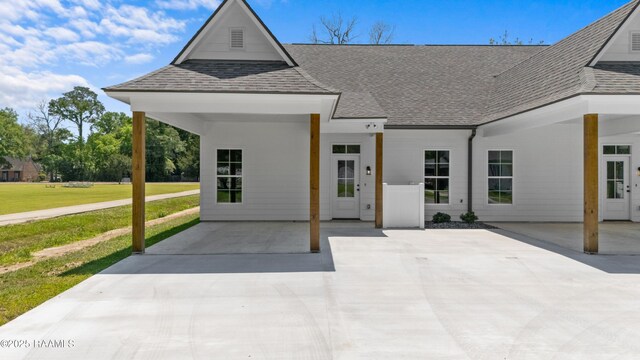 210 E D St, Rayne, LA 70578 - view of front facade featuring a shingled roof and a front lawn