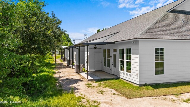 210 E D St, Rayne, LA 70578 - rear view of house featuring a patio area and a shingled roof