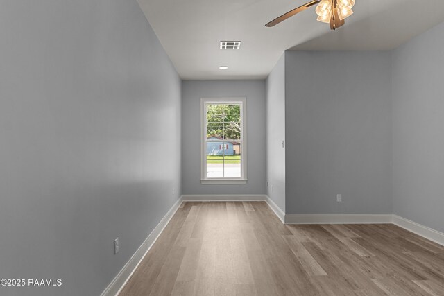210 E D St, Rayne, LA 70578 - empty room with wood finished floors, visible vents, a ceiling fan, and baseboards