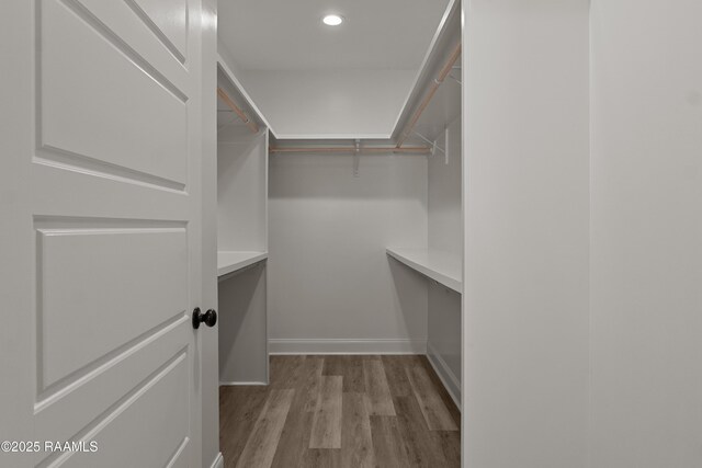 210 E D St, Rayne, LA 70578 - walk in closet featuring wood finished floors