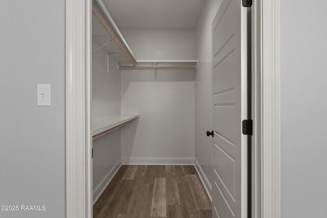 210 E D St, Rayne, LA 70578 - spacious closet featuring dark wood finished floors
