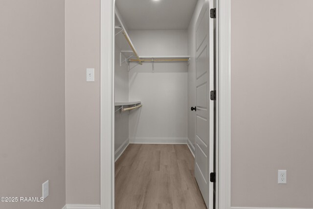 210 E D St, Rayne, LA 70578 - walk in closet with light wood-style flooring