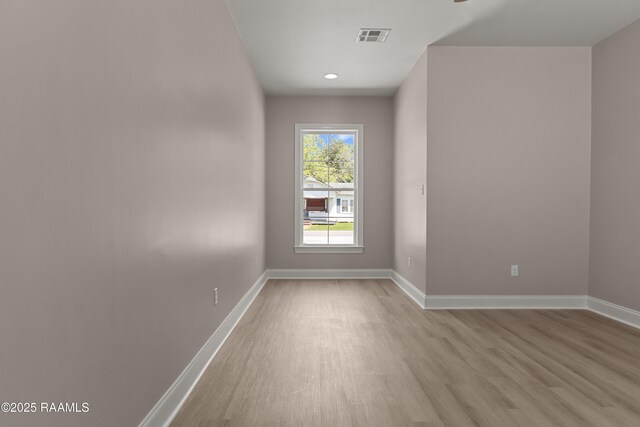 210 E D St, Rayne, LA 70578 - spare room featuring baseboards, wood finished floors, and visible vents