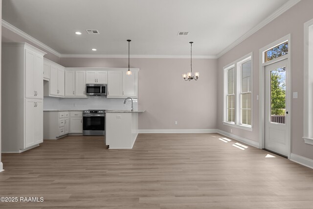 210 E D St, Rayne, LA 70578 - kitchen featuring stainless steel appliances, baseboards, visible vents, a notable chandelier, and crown molding