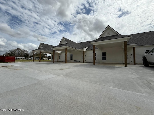 view of front of property with a shingled roof