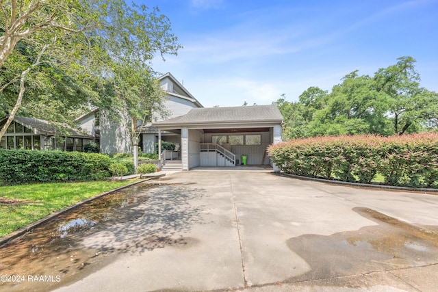 view of front of home featuring a carport