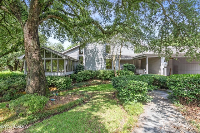 view of front of home featuring a sunroom