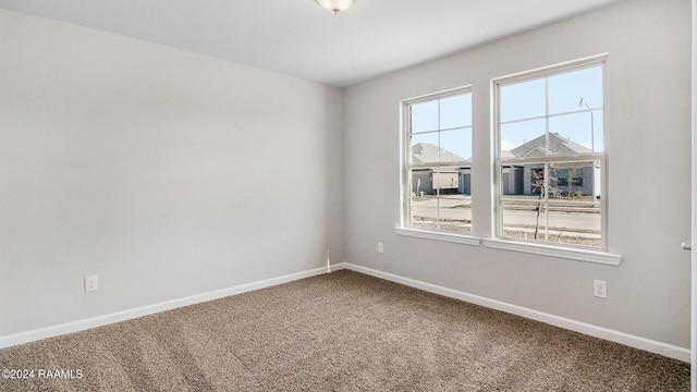 unfurnished room with carpet