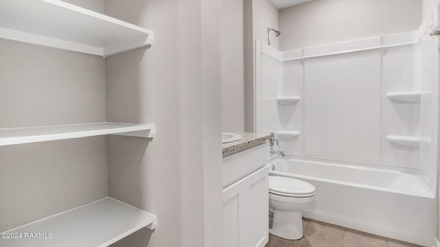 full bathroom with tile patterned floors, vanity,  shower combination, and toilet