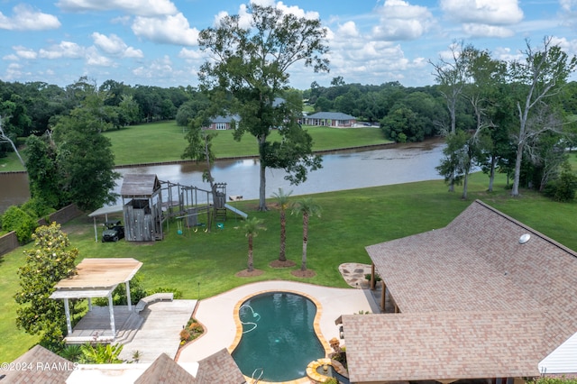 view of pool featuring a playground, a water view, and a patio area