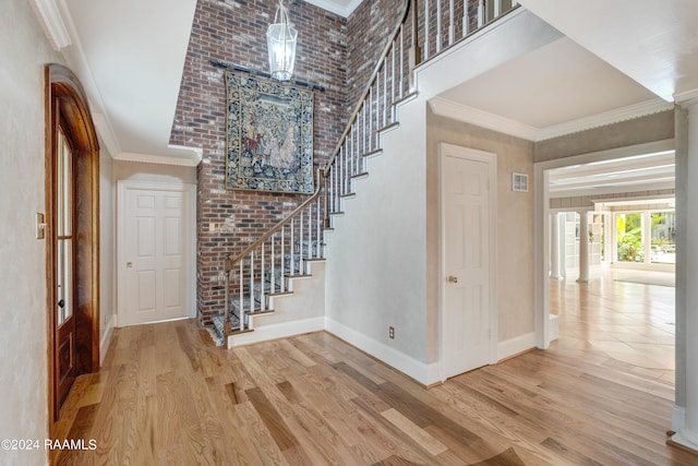 120 Kimball Dr, Lafayette, LA 70508 - foyer entrance with stairs, wood finished floors, a towering ceiling, baseboards, and ornamental molding