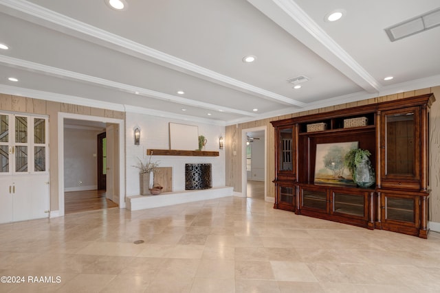 unfurnished living room featuring crown molding, beamed ceiling, and ceiling fan