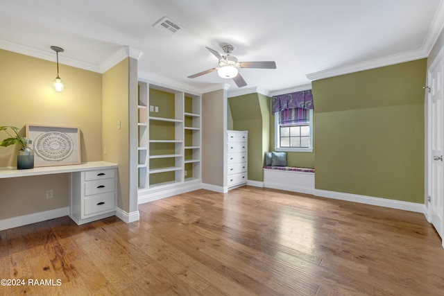 unfurnished bedroom with hardwood / wood-style flooring, ceiling fan, and crown molding