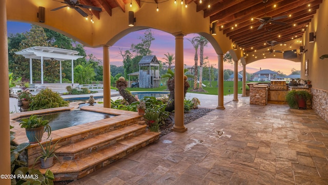 120 Kimball Dr, Lafayette, LA 70508 - view of patio / terrace with ceiling fan, exterior kitchen, an in-ground hot tub, and fence
