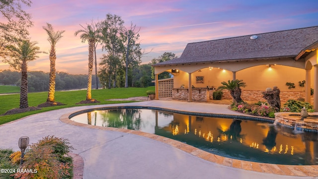 120 Kimball Dr, Lafayette, LA 70508 - pool at dusk featuring a patio, a yard, and a pool with connected hot tub