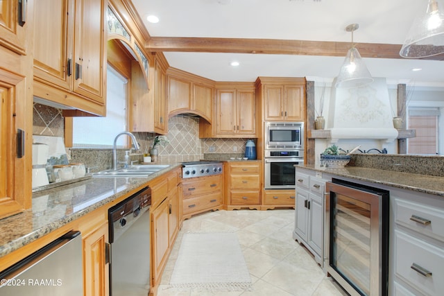 kitchen featuring light stone countertops, sink, hanging light fixtures, wine cooler, and appliances with stainless steel finishes