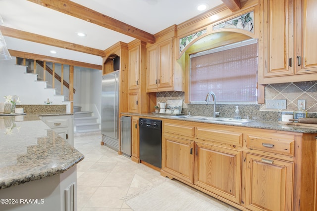 kitchen with backsplash, dishwasher, light stone counters, and sink