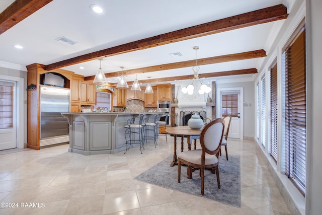 kitchen featuring pendant lighting, decorative backsplash, beam ceiling, a kitchen island, and stainless steel appliances