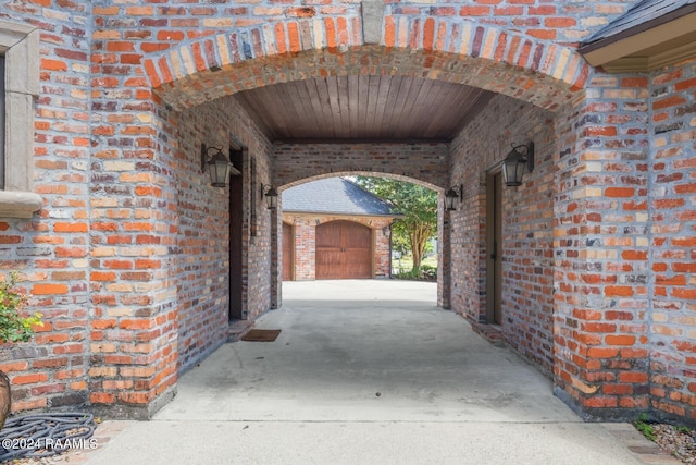 view of patio / terrace featuring a garage