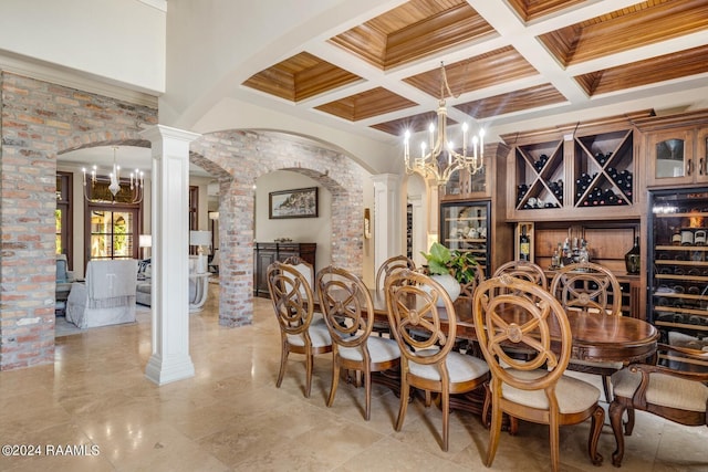 dining space featuring coffered ceiling, beamed ceiling, a notable chandelier, decorative columns, and crown molding