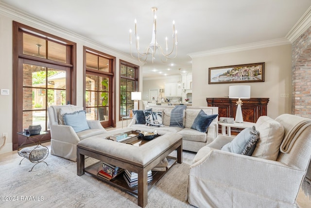 living room featuring a chandelier and crown molding